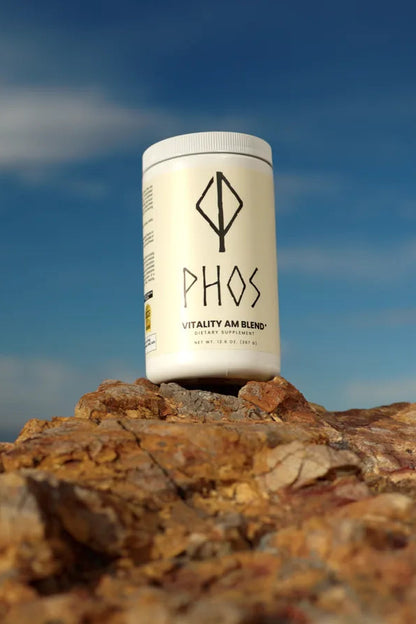 Phos Vitality AM Blend container outdoors against a morning sky