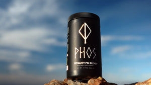 Phos Vitality PM Blend container outdoors against an evening sky